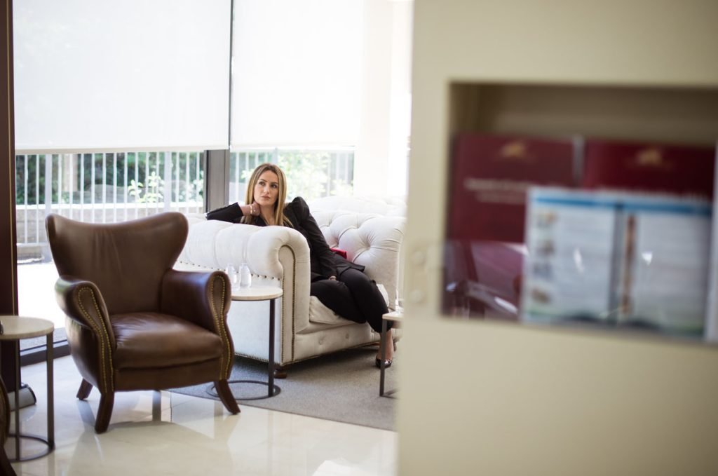 Guest waiting alone in a hotel lounge before an event