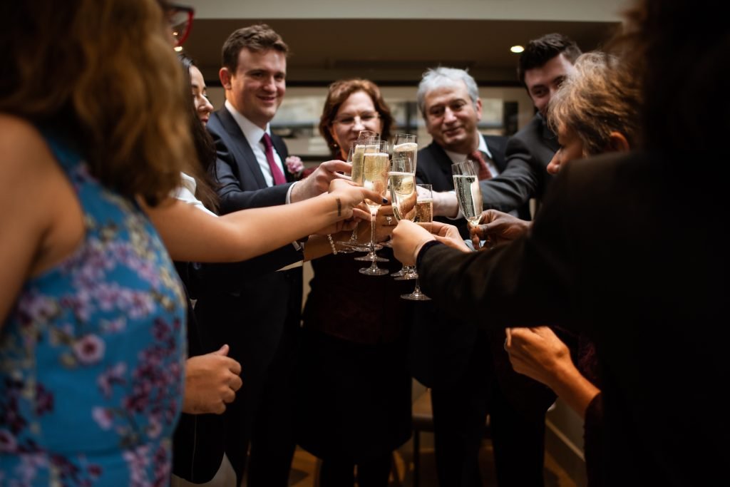 Guests raising champagne glasses in a toast