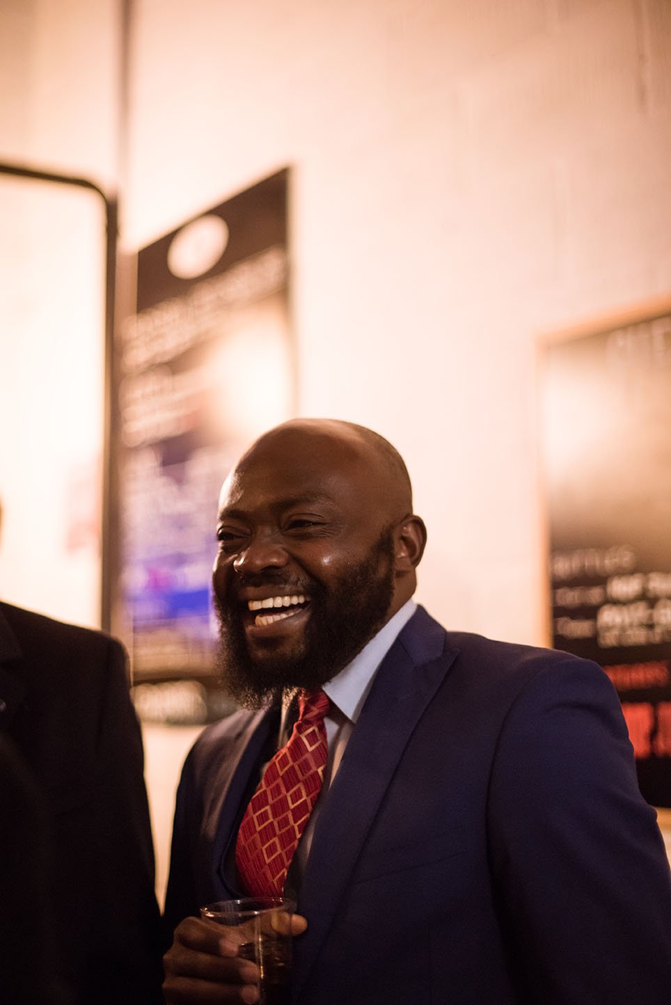 A guest laughing during a wedding party.